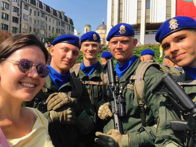 Maria Romanenko poses with officers from the Ukrainian National Guard during Kyiv’s Independence Day celebrations in 2021. Credit: Maria Romanenko