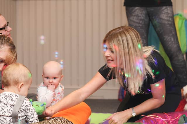Bubbles and coloured lights create a sensory atmosphere during a Bloom Baby class. Credit: Bloom Baby
