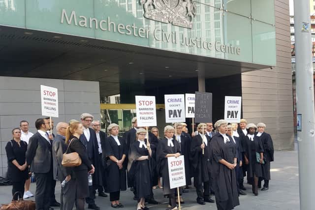 Barristers taking part in a walk-out at Manchester Civil Justice Centre