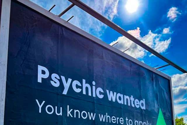 The billboard searching for a psychic in Manchester