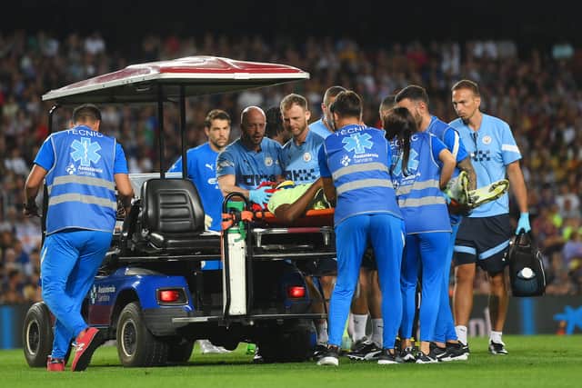 Luke Mbete was taken off on a stretcher in the latter stages of the game. Credit: Getty.