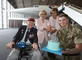 Peter, his daughters and a member of 653 Sqn Air Army Corps with his birthday cake. Credit: Manchester Airport