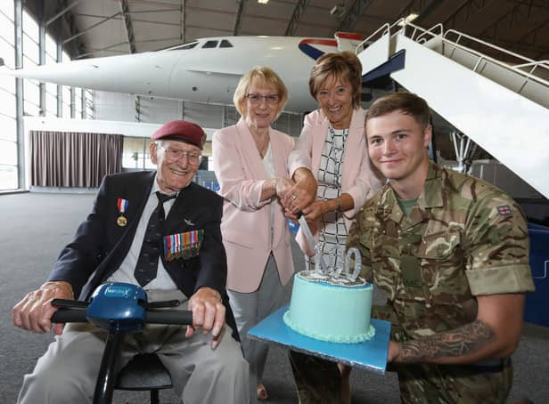 <p>Peter, his daughters and a member of 653 Sqn Air Army Corps with his birthday cake. Credit: Manchester Airport</p>