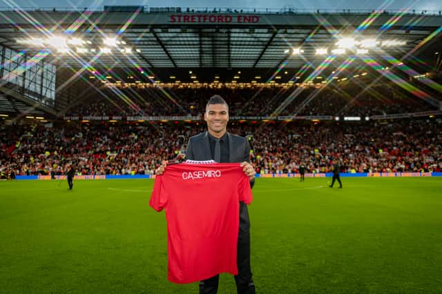Casemiro was presented on the Old Trafford pitch without a shirt number, on Monday night. Credit: Getty.