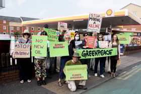 Campaigners protesting against the Jackdaw gas field plans outside a Shell petrol station in Manchester