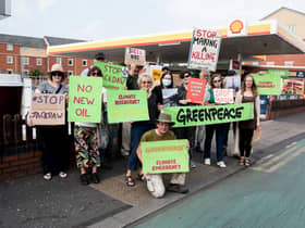 Campaigners protesting against the Jackdaw gas field plans outside a Shell petrol station in Manchester