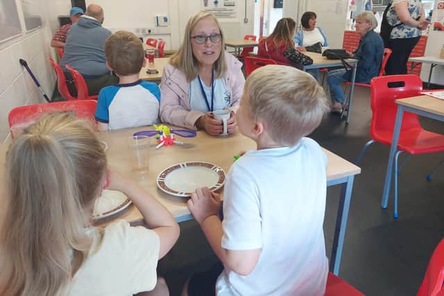Mrs C Burgess and her grandchildren enjoying an afternoon at the Community Cafe in Droylsden. Credit: Sofia Fedeczko/Manchester World
