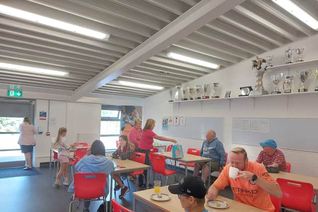 Visitors to the Community Cafe in Droylsden enjoy some refreshments. Credit: Sofia Fedeczko/Manchester World