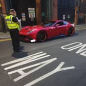 Greater Manchester Police dealing with the Ferrari in the city centre