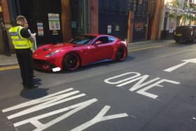 Greater Manchester Police dealing with the Ferrari in the city centre