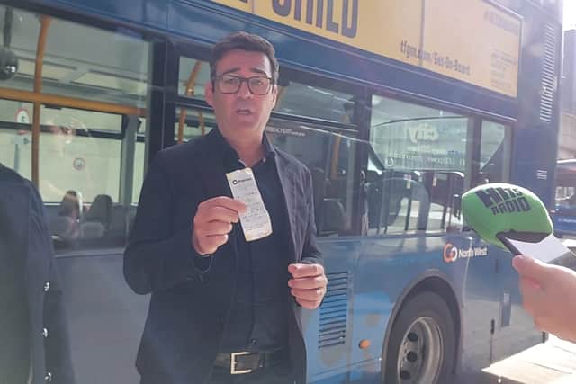 Mayor Andy Burnham showing off his new £5 day ticket, which came into force on September 4. Credit: Sofia Fedeczko/Manchester World