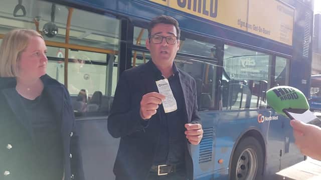 Mayor Andy Burnham showing off his new £5 day ticket, which came into force on September 4. Credit: Sofia Fedeczko/Manchester World