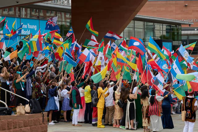 Delegates with their flags ahead of the opening of the One Young World summit. Photo: One Young World