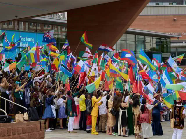 Delegates with their flags ahead of the opening of the One Young World summit. Photo: One Young World