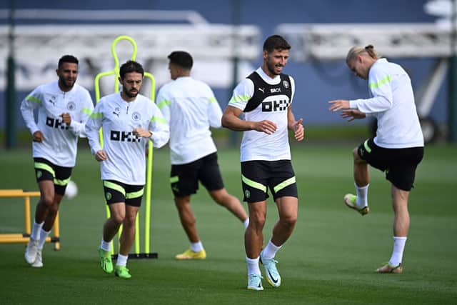 Man City players Ruben Dias, Bernardo Silva, Riyad Mahrez, Joao Cancelo and Erling Haaland train ahead of their opening Champions League Group G fixture against Sevilla