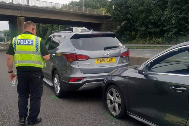John Barlow placed his Hyundai Santa Fe SUV in front of the stricken Audi on the M62 Credit: SWNS
