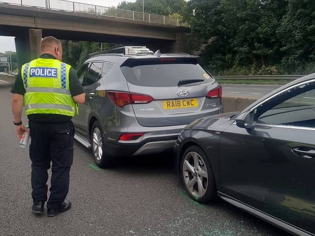 John Barlow placed his Hyundai Santa Fe SUV in front of the stricken Audi on the M62 Credit: SWNS