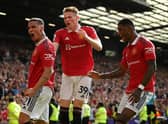 Antony celebrates with Scott McTominay and Marcus Rashford after scoring on his United debut