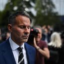 Forrmer Manchester United star and Wales manager Ryan Giggs reacts as he leaves the Manchester Minshull Street Crown Court Credit: Getty