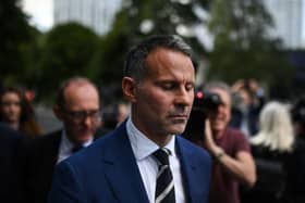 Forrmer Manchester United star and Wales manager Ryan Giggs reacts as he leaves the Manchester Minshull Street Crown Court Credit: Getty
