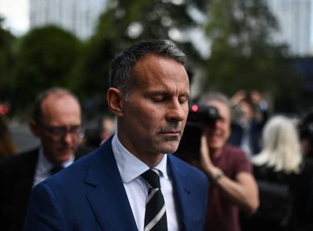 <p>Forrmer Manchester United star and Wales manager Ryan Giggs reacts as he leaves the Manchester Minshull Street Crown Court Credit: Getty</p>