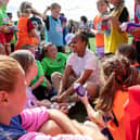 Manchester United and England forward Nikita Parris visits Weetabix Wildcats under 12s girls football players Credit: SWNS