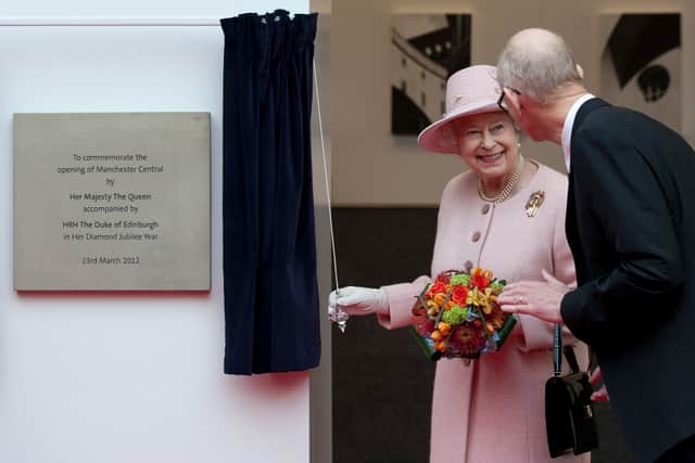 Queen Elizabeth II smiles after unveiling a plaque during her visit to the Manchester Central convention centre on March 23, 2012 Credit: Getty