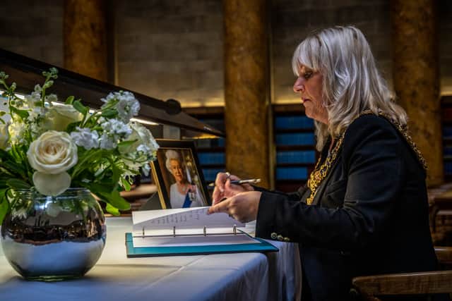 Manchester’s Lord Mayor Coun Donna Ludford signs the book of condolence for the Queen Credit: Manchester city council