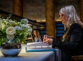 Manchester’s Lord Mayor Coun Donna Ludford signs the book of condolence for the Queen Credit: Manchester city council