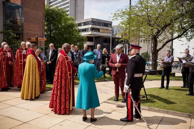 The Queen meets Manchester Lesbian and Gay Chorus director Dan McDwyer at Manchester Cathedral in July 2021. Credit: Manchester Cathedral. 