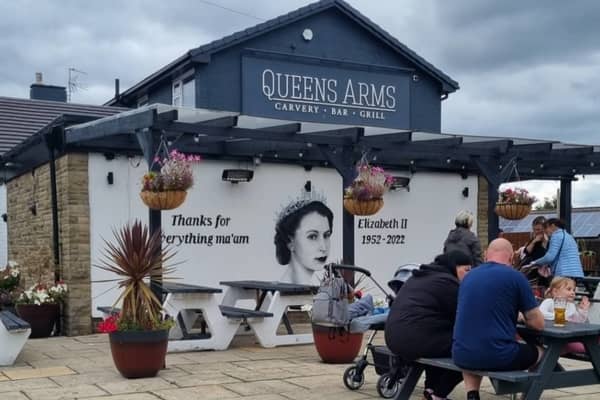Scott Wilcocks (also known as Snow Graffiti), made a permanent tribute of the Queen at the Queens Arms pub in Manchester Credit: PA