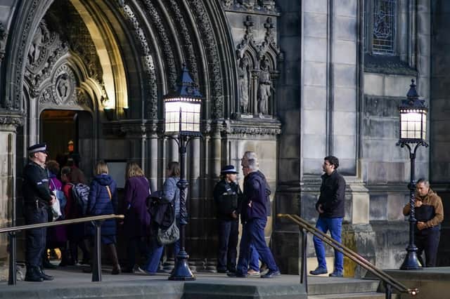 Members of the public continue to queue to pay their respects as Queen Elizabeth II lies in state in St Giles' Cathedral 