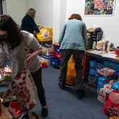EDINBURGH, SCOTLAND - FEBRUARY 21: Volunteers are seen packing food parcels on March 02, 2022 in Edinburgh, Scotland. With the cost of living rocketing in the uk, annual inflation rocketed by 5.4 per cent in December more than the Bank of Englands 2 percent target, food bank charity the Trussell Trust estimate more than 5,100 food parcels are provided to households every day. Three emergency food parcels are handed out to cash-strapped families every minute in the UK as the cost-of-living crisis continues. (Photo by Peter Summers/Getty Images)