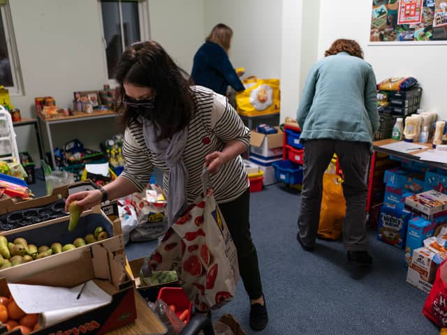 EDINBURGH, SCOTLAND - FEBRUARY 21: Volunteers are seen packing food parcels on March 02, 2022 in Edinburgh, Scotland. With the cost of living rocketing in the uk, annual inflation rocketed by 5.4 per cent in December more than the Bank of Englands 2 percent target, food bank charity the Trussell Trust estimate more than 5,100 food parcels are provided to households every day. Three emergency food parcels are handed out to cash-strapped families every minute in the UK as the cost-of-living crisis continues. (Photo by Peter Summers/Getty Images)