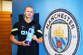 Erling Haaland with the August 2022 Premier League Player of the Month award. Credit: Manchester City.