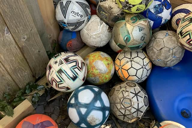 The pile of balls returned when the neighbour moved out Credit: SWNS