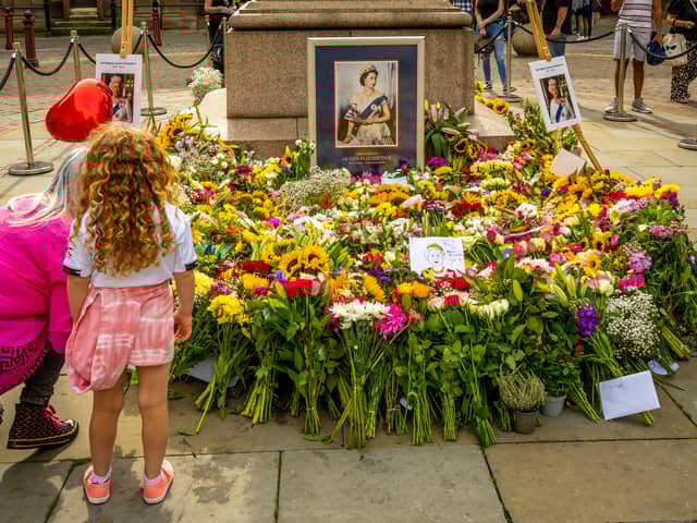 People began leaving flowers and messages in St Ann’s Square Manchester soon after the announcement of Her Majesty Queen Elizabeth II’s death. Credit: Manchester City Council