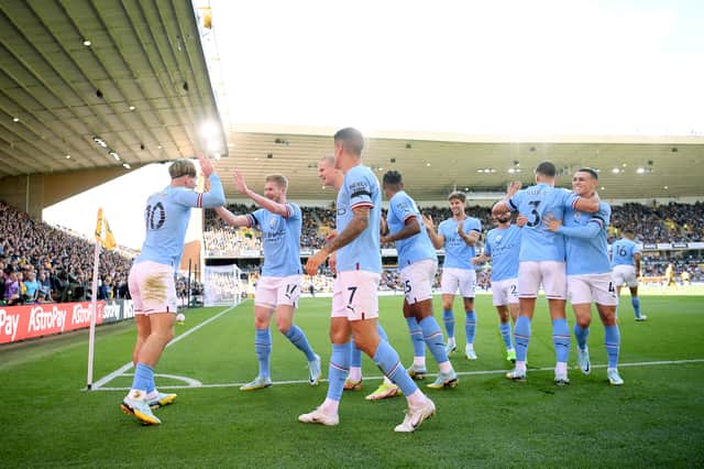 Jack Grealish of Manchester City celebrates with Kevin De Bruyne after scoring their side’s first goal against Wolves Credit: Getty