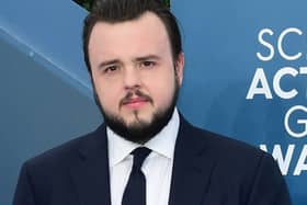 John Bradley is no stranger to big-budget, action-filled productions like James Bond having starred as Samwell Tarley in Game of Thrones. Originally from Wythenshawe, John has had three films out this year already, including “The Return of the Railway Children” and “Moonfall.” (Photo by FREDERIC J. BROWN/AFP via Getty Images)