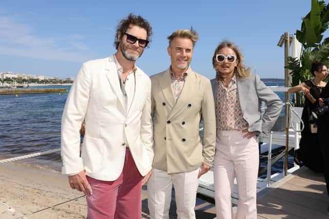 Take That attend the photocall for “Greatest Days” during the 75th annual Cannes film festival Credit: Getty