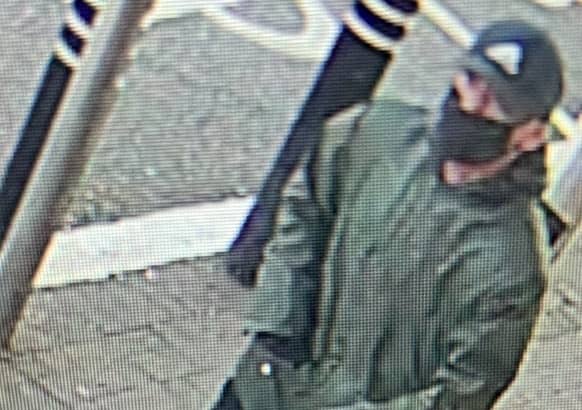 <p>Police are searching for this man after nearly £30k was taken in a cash-in-transit robbery at Asda Hulme Credit: GMP</p>