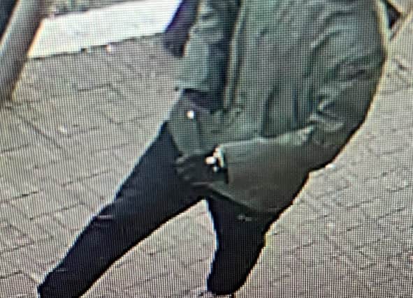 Police are searching for this man after nearly £30k was taken in a cash-in-transit robbery at Asda Hulme Credit: GMP