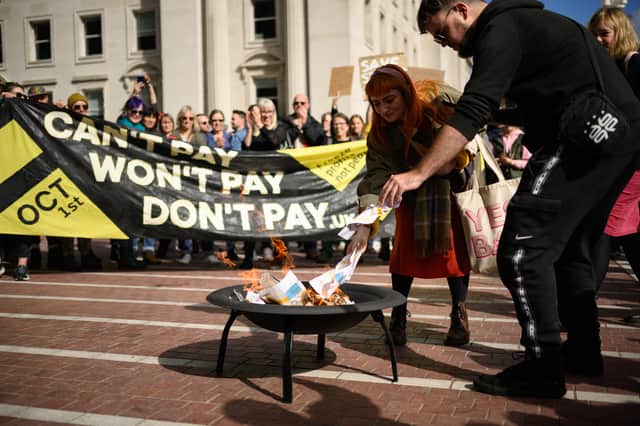 Protesters on the streets of Birmingham are setting fire to their energy bills.