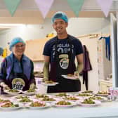 FoodCycle volunteers serving the free meals at one of its projects