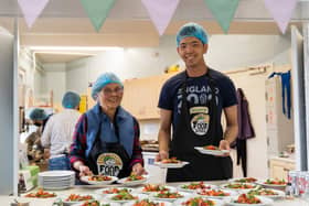 FoodCycle volunteers serving the free meals at one of its projects