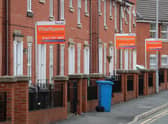 Boards advertising houses for rent in Manchester. Photo: Getty Images