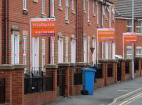 Boards advertising houses for rent in Manchester. Photo: Getty Images