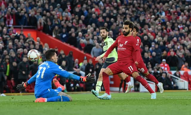 Mohamed Salah scores the only goal of Liverpool’s 1-0 win over Manchester City (Photo by Laurence Griffiths/Getty Images)