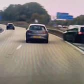 A screen grab from footage of a driver cheating death with a last-minute turn across the M60 in Manchester. Photo: SWNS