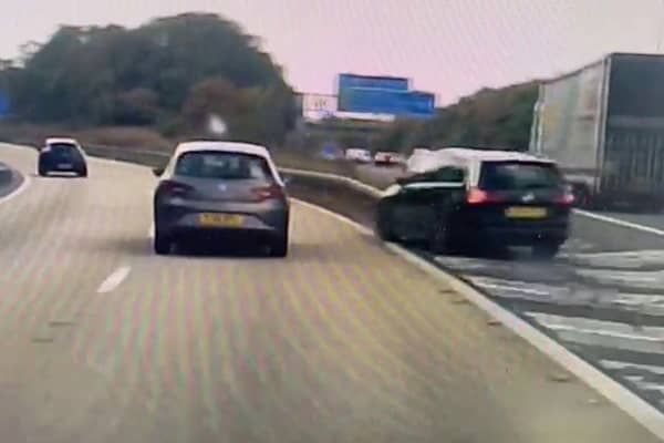 A screen grab from footage of a driver cheating death with a last-minute turn across the M60 in Manchester. Photo: SWNS